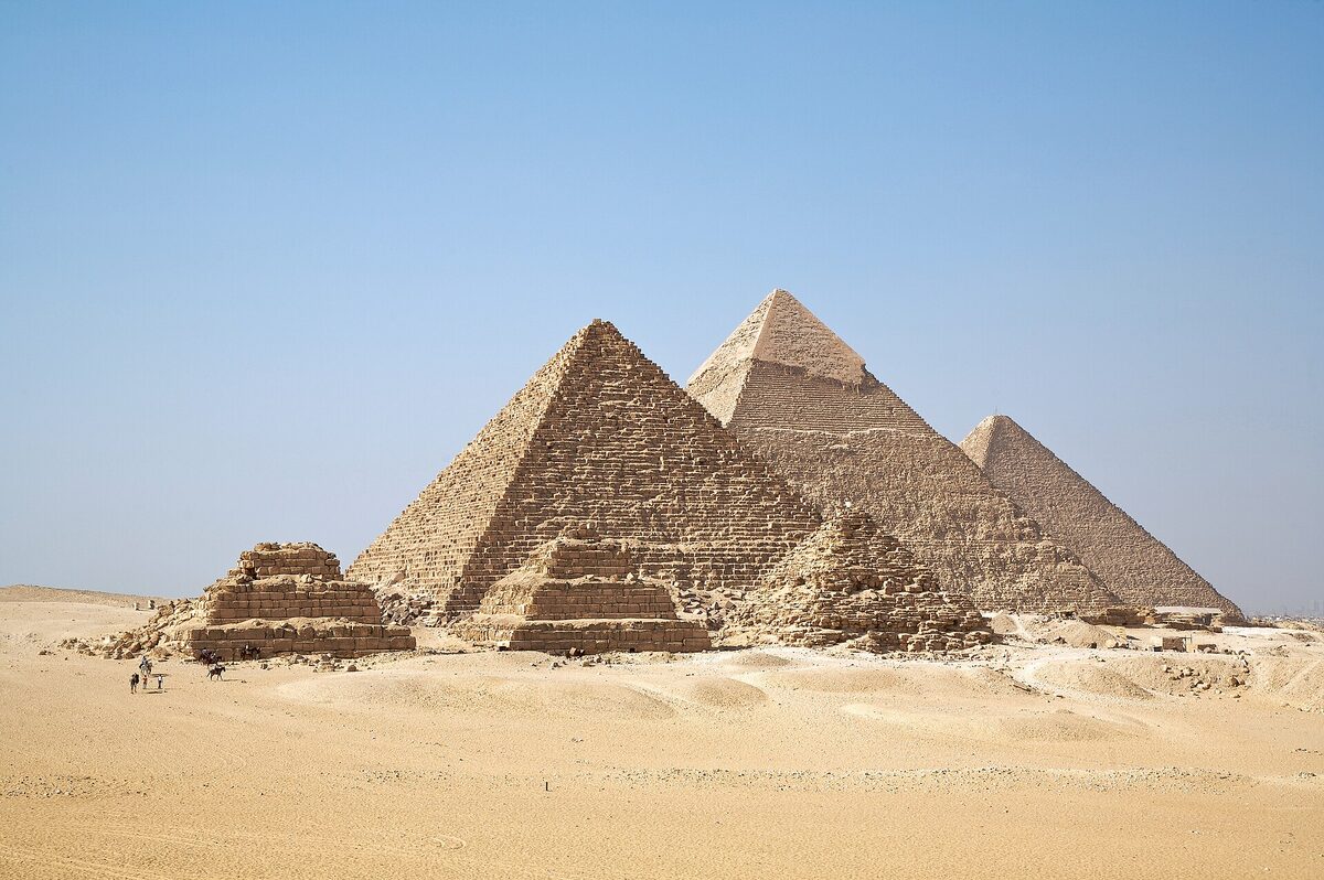 The three great pyramids of the Giza plateau aligned under a clear sky