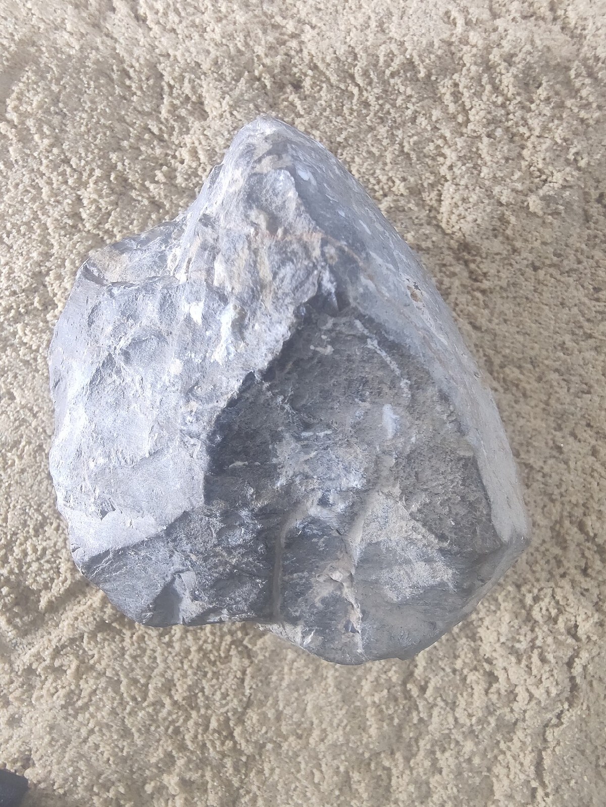 Oldowan chopper stone tool, earliest confirmed stone-knapping technology, 2.6 million years ago