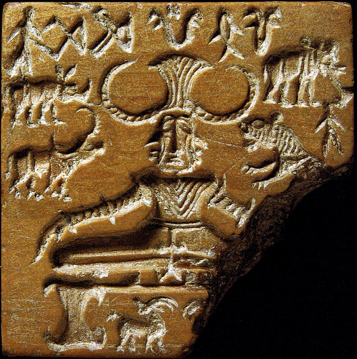 Sceau de l'Indus dit Pashupati, montrant un personnage assis entouré d'animaux, et une ligne de signes gravés